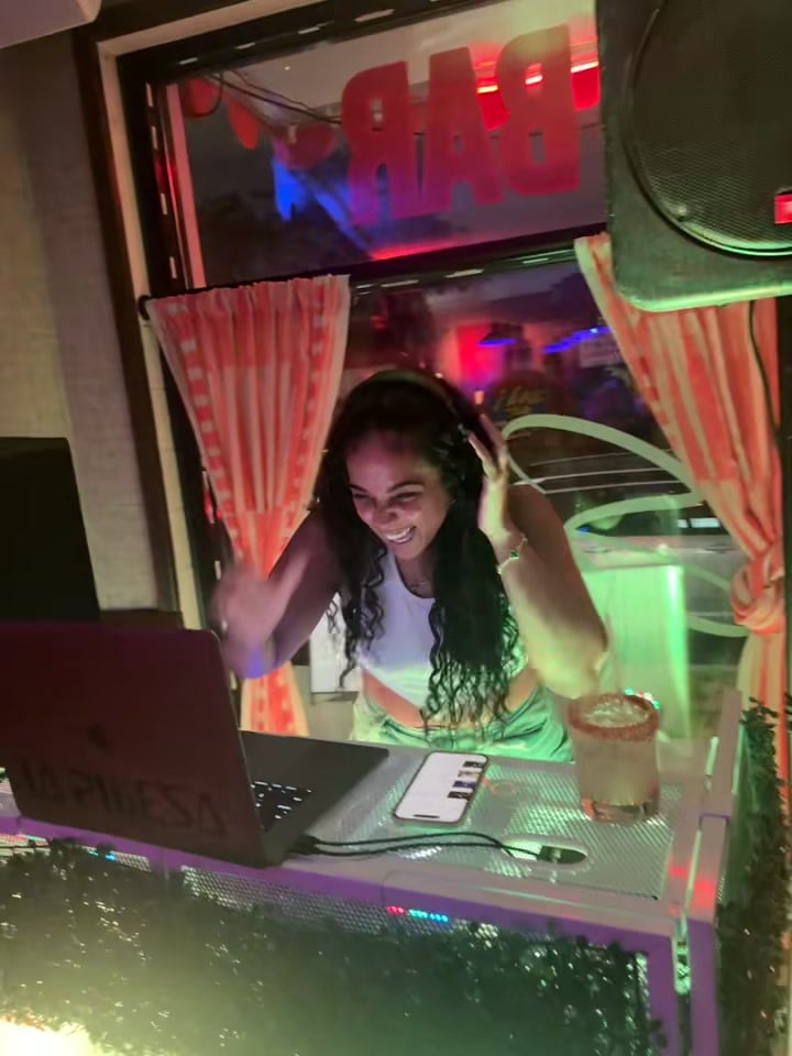 Both hands on her headphones and mid-laugh, La Phiesa cues the next track at the Saucey pizza-bar takeover.