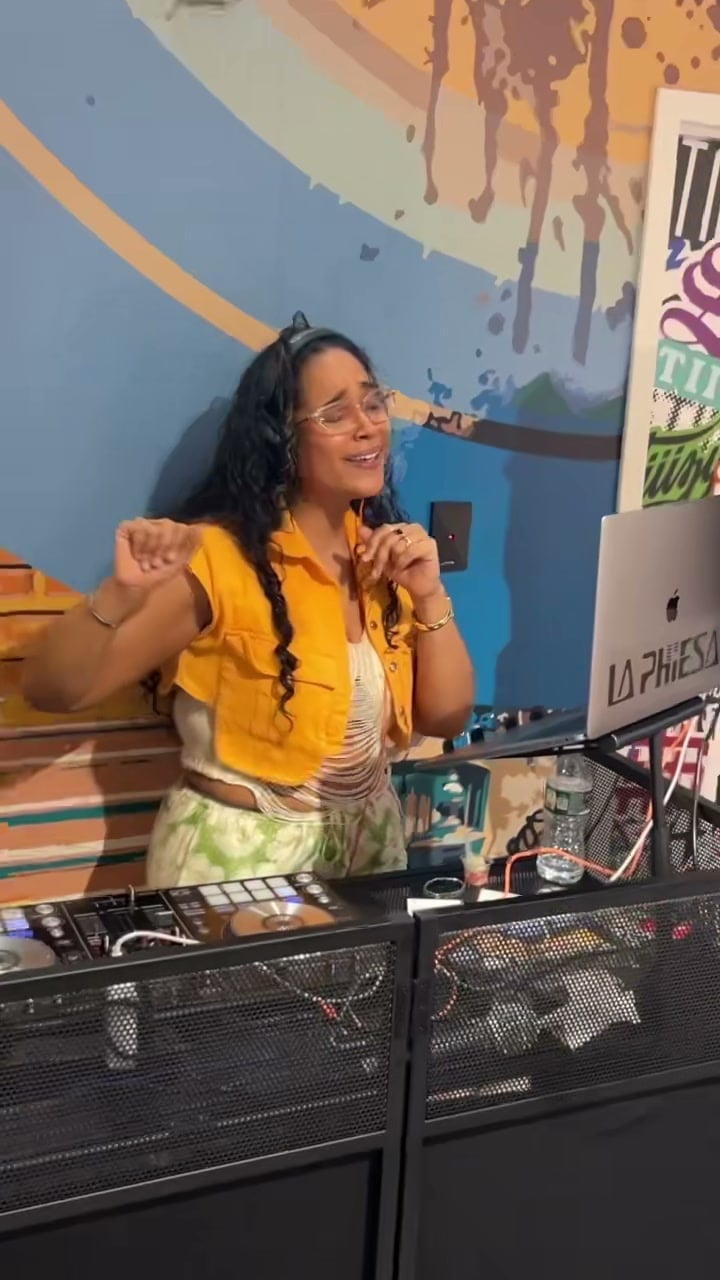 La Phiesa dancing behind the decks at Stoops, caught mid-record in her own set